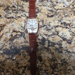 Classic Brown Leather Strap Watch with Gold Accents Automatic Winding  Mechanism